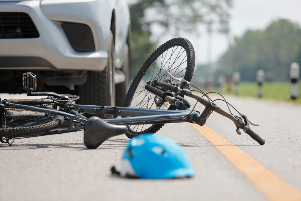 Image of a bike on the street after an accident. | San Benito County Bicycle Accident Attorney. 